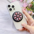 Detail view of a vintage floral pink marble phone grip stand on a white smartphone - Pink Marble Exquisite Floral (Songshi-10)