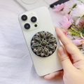 Detail of vintage green agate phone grip with floral metal frame and sunburst design - Olive Green Gemstone Radial (Songshi-12)