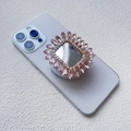 Macro del supporto per cellulare pieghevole di lusso con strass su uno smartphone - Stile Airbag Magnetico / Rosa