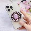 Macro detail of sunflower style MagSafe phone grip with pink marble stone texture - Pink Sunflower Floral Shape (Songshi-8)