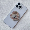 Dettaglio del supporto per telefono estensibile con strass rosa e bianchi a fiori - Supporto Magnetico / Rosa