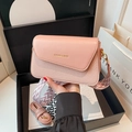 Pink patchwork leather crossbody bag with wide herringbone strap and gold text logo - Pink