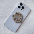 Detail of expandable phone grip with sparkling purple and clear rhinestones on white phone - Magnetic Stand / Purple