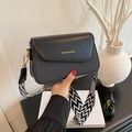 Elegant black square crossbody bag with textured body and wave pattern woven strap - Black