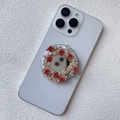 Vista macro di un supporto magnetico per telefono con strass rossi e bianchi su smartphone viola - Supporto Magnetico / Rosso