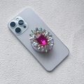 Detailed close-up of a luxury rose red gemstone phone socket with colorful rhinestones - Magnetic Airbag Stand / Rose Red Gem