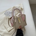 Elegant off-white lychee leather bucket bag with silk scarf handle and gold metal clasp - Off-white