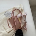 Pink lychee texture bucket bag with elegant silk scarf handle and gold buckle detail - Pink