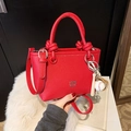Red lychee pattern bucket bag with knot handle and baseball charm accessories - Red