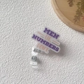 Detail showing retractable badge reel with acrylic quote plate and alligator clip - Men Lie Numbers Don't (4)