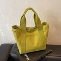 Borsa tote minimalista in tela giallo senape con doppi manici e bottoni a pressione laterali - Verde