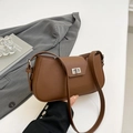 Vintage brown lychee grain leather shoulder bag with elegant silver twist-lock closure - Brown