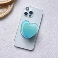 Detail of light blue heart-shaped MagSafe pop socket on a silver smartphone back - Magnetic Stand / Light Blue (Gradient Heart-6)