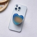 Detail of blue and orange gradient heart-shaped MagSafe phone grip on a white surface - Magnetic Stand / Blue-Orange Gradient (Gradient Heart-5)