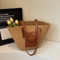 Khaki woven tote bag with brown leather straps and front pocket on white stairs - Khaki