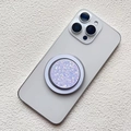 Detail of a purple glitter magnetic phone socket on a white smartphone back - Magnetic Stand / Translucent Pink