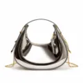 Detail of silver crescent hobo bag with glossy mirror finish and gold chain strap - Large / Silver
