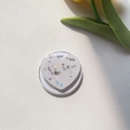 Close-up of heart-shaped Magsafe grip with colorful glitter and tulip leaf detail - Magnetic Stand / White Silver Foil Glitter Heart