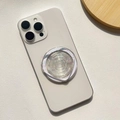 Detail of a transparent phone grip with colorful star sequins on a white smartphone - Magnetic Stand / Translucent Star - Heart Shape
