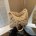 Chic cream white crochet bucket bag with hollow floral pattern and side fringe tassels - White
