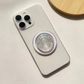 Close-up of heart-shaped phone grip with colorful star sequins on a white smartphone - Magnetic Stand / Translucent Star - Round Shape