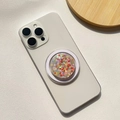 Macro detail of a round folding phone grip with colorful heart-shaped glitter sequins - Magnetic Stand / Colorful Heart - Round Shape