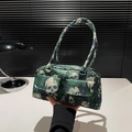 Dark green shoulder bag featuring skull and rose prints with dual front flap pockets - Green