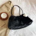 Faux fur shoulder bag in black plush finish with sleek leather strap and white pompom - Black