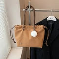Minimalist camel nylon tote bag with leather handles and white plush charm on a hanger - Brown