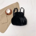 Minimalist black faux fur drawstring backpack with soft texture and woven shoulder straps - Black