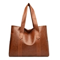 Minimalist caramel brown PU leather tote bag with a spacious design and long handles - Yellow Brown