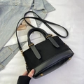 Chic black patchwork pillow bag with suede finish and vintage gold hardware accents - Black