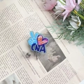 Macro detail of CNA acrylic ID badge reel with blue glitter and 360-degree swivel clip - Light Blue CNA Badge Reel