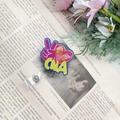 Macro shot of CNA badge reel with watercolor tie-dye heart and rotating back clip - Dark Blue CNA Badge Reel