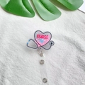 Detail of heart-shaped acrylic nurse badge reel with liquid glitter and life text - Pink Purple Heart Stethoscope Style (8)