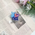 Detail of CNA acrylic retractable badge reel with 360 rotation and nursing theme design - Silver CNA Badge Reel