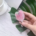 Detail of heart-shaped acrylic badge reel featuring a pink Caladium leaf texture - Peach Leaf