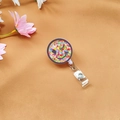 Detail of acrylic star glitter badge reel with a winking smiley face design - Smiling Star