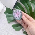Detail of leaf-shaped acrylic badge reel with pink vein texture and retractable cord - Leaf 1