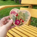 Macro shot of heart-shaped wooden resin coaster with real pressed flowers and leaves - Heart-10.5cm