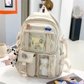 Beige nylon rugzak met meerdere vakken voor studenten inclusief badges en koe-hanger - Met Hangers en Badges / Broken Wit