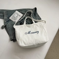 Witte canvas draagtas met blauwe Mearey belettering en een verstelbare schouderriem - Broken Wit