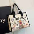 Canvas-Tragetasche in Beige mit schwarzen Griffen und Vintage-Cartoon-Graffiti - Schwarz (Cremeweiß mit schwarzem Rand)
