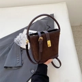 Dark brown suede bucket bag with top handle and adjustable strap in a retro style - Brown