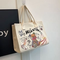 Naturweiße Canvas-Tasche mit bunten Graffiti-Prints und robusten Schultergurten - Weiß (Cremeweiß)