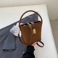 Brown vintage suede bucket bag with metal lock and adjustable shoulder strap - Brown