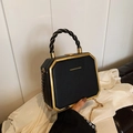 Elegant black box handbag with gold trim and chain strap, featuring fashion lettering - Black
