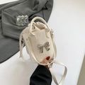 French style beige bucket bag with bow detail, drawstring closure and crossbody strap - White