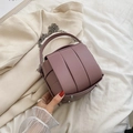Dusty pink woven bucket bag with leather cross pattern and silver chain shoulder strap - Dusty Pink