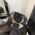 Modern black lychee leather bucket bag with chunky gold chain and small pouch - Black